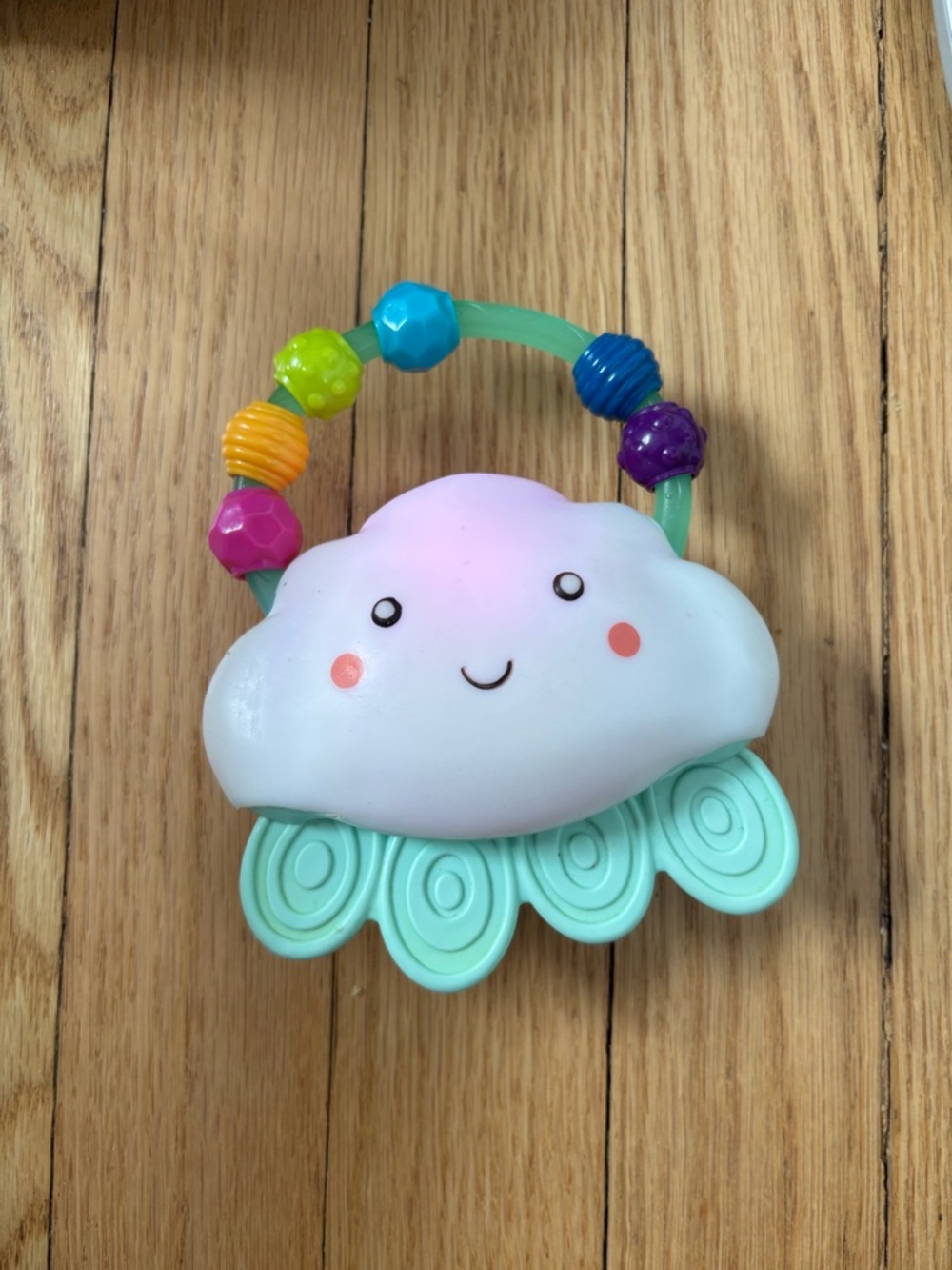 B. toys Rain Glow Squeeze Light-Up Cloud Rattle Toy Baby Teether
